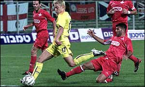 Alan Smith smashes in Leeds' first goal against Hapoel Tel Aviv 