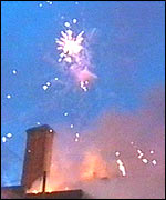 Fireworks explode from the building