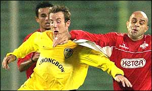 Lee Bowyer holds off a challenge from a Hapoel defender