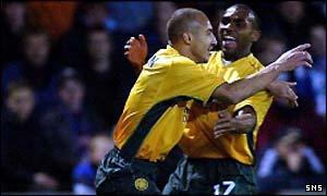 Henrik Larsson celebrates his goal with Didier Agathe