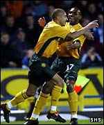 Larsson celebrates his goal with Didier Agathe
