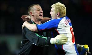 Rab Douglas and Neil Lennon celebrate the win