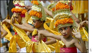 Balinese girls perform a dance during the purification ceremony at the bomb site in front of the Sari Club in Kuta, Bali
