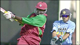 Gayle pulls a short ball to the fence
