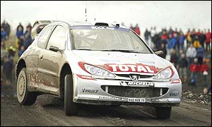 Marcus Gronholm speeds past crowds on the Rally GB