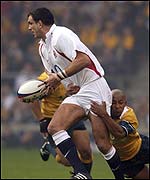 England captain Martin Johnson is tagged by counterpart George Gregan