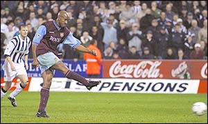 Dion Dublin strikes the penalty which was saved by West Brom keeper Russell Hoult