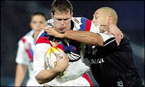 Great Britain's Stuart Fielden is tackled by New Zealand's Paul Rauhihi 