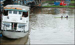 Canoe passers the boat
