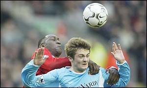 Emile Heskey battles with Michael Proctor