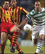 Derek Whyte challenges Celtic's Henrik Larsson