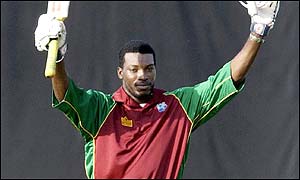 Chris Gayle salutes the crowd as he makes a century