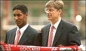 Nicolas Anelka poses with Arsenal manager Arsene Wenger after signing for Arsenal
