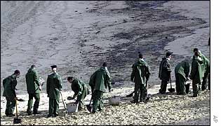 Spanish sailors help clean up a beach near Malpica in north-west Spain
