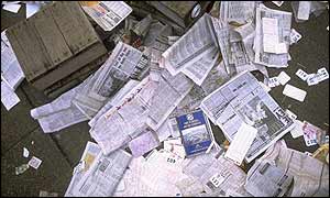 Newspapers scattered on the ground after the Grand National