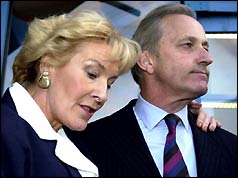 Christine and Neil Hamilton speak to reporters outside Barkingside police station