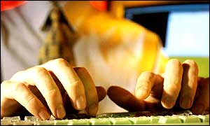 Man sits at keyboard