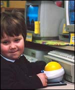 A nursery pupil with a computer
