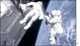 Astronauts working on the International Space Station