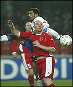 John Hartson in an aerial challenge