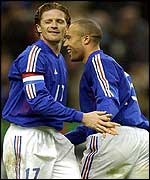 Emmanuel Petit of France with team-mate Mikael Silvestre 