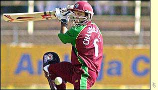 Shivnarine Chanderpaul hits out on the way to his 58 against India before being caught behind off Agarkar