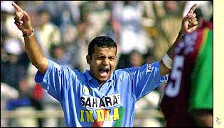 Murali Kartik celebrates one of his three wickets