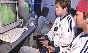 Young South Korean men taking part in gaming competition, Seoul