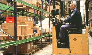 Boxes stacked on wooden pallets in a warehouse