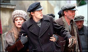 Keira Knightley as Lara Guishar and Kris Marshall as Pasha