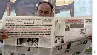 An Iraqi man reads al-Thawrah