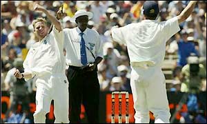 Richard Dawson (left) celebrates his first wicket of the match