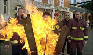 Firefighters man a picket line 
