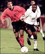 Rafael van der Vaart of Holland and England's Jermaine Defoe battle during a European Championship qualifier at Pride Park in 2001