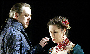 Peter Coleman-Wright as Scarpia and Cheryl Barker as Tosca, photo by Alastair Muir