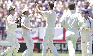 Jason Gillespie (centre) is mobbed by team-mates