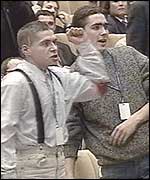 Protestors throwing tomatoes at Lord Robertson's news briefing