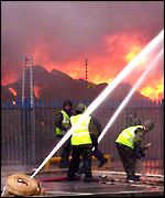 Army firefighters tackle the factory blaze