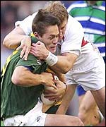Werner Greef of South Africa is tackled by Mike Tindall 