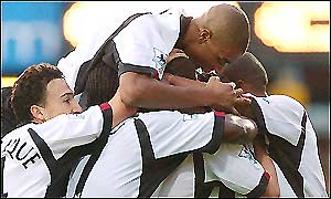 Sean Davis is mobbed by his team-mates