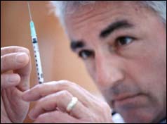 Doctor prepares an injection