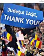Romanian woman holding a banner