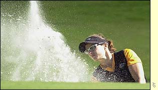 Rachel Teske plays out of a bunker at the Trump International course