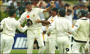 Glenn McGrath celebrates with team-mates