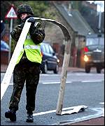 Soldier carrying hose on Tyneside