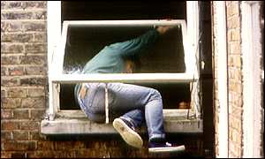 Man climbing into window