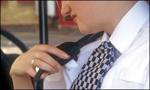 Police officer speaks into radio