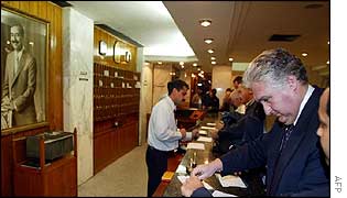 Weapons inspector Jacques Baute checks into Baghdad hotel