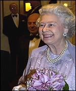 The Queen holds an ornamental mousetrap