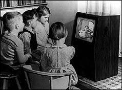 Children watching black and white TV